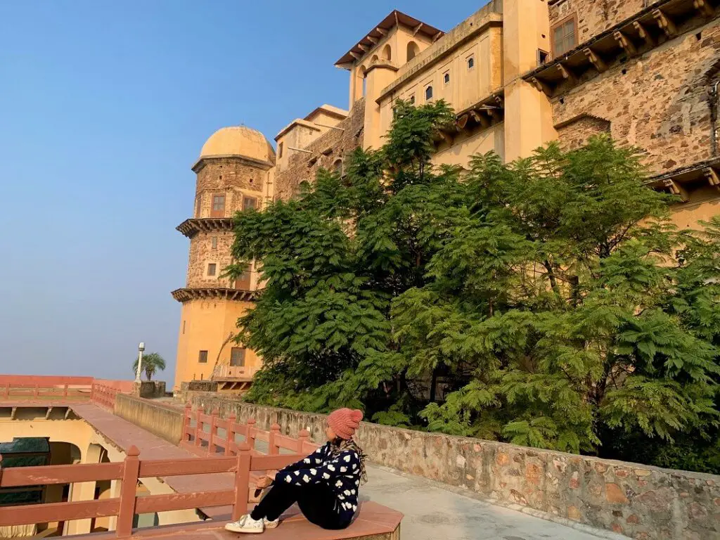 Posing with the Rani Mahal as the backdrop