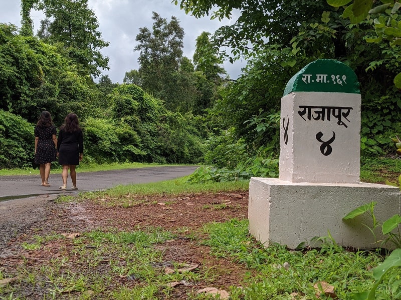 Posing at Rajapur milestone before the turn to NH66