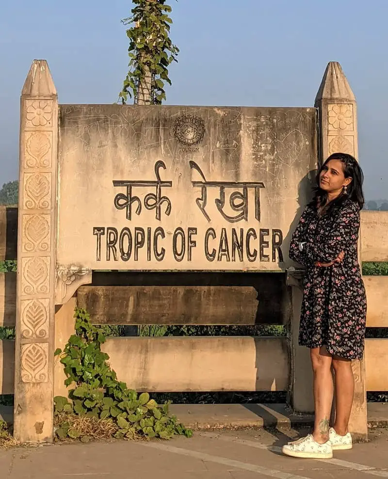 Posing at Tropic of Cancer sign board